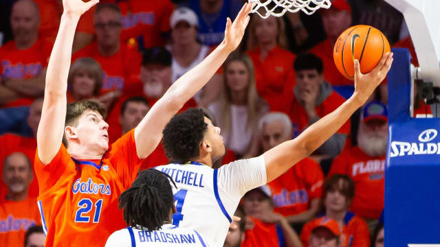 Florida Gators forward Alex Condon (21) defends a shot by Kentucky Wildcats forward Brennan Canada (14). The Florida men s basketball team hosted the Kentucky Wildcats at Exactech Arena at the Stephen C. O Connell Center in Gainesville, FL on Saturday, January 6, 2024 during the first half. [Doug Engle/Ocala Star Banner]