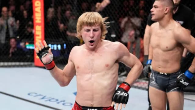 Paddy Pimblett celebrates a victory under the UFC banner.