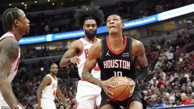 Chicago Bulls guard Coby White (0) defends Houston Rockets forward Jabari Smith Jr. (10) during the first quarter at United Center.