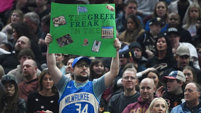 A fan holds a sign in support of Milwaukee Bucks forward Giannis Antetokounmpo (34) 