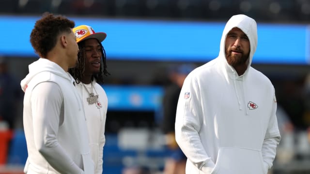 Jan 7, 2024; Inglewood, California, USA; Kansas City Chiefs quarterback Patrick Mahomes (15) talks to wide receiver Rashee Rice (4) and tight end Travis Kelce (87) before the game against the Los Angeles Chargers at SoFi Stadium. Mandatory Credit: Kiyoshi Mio-USA TODAY Sports  