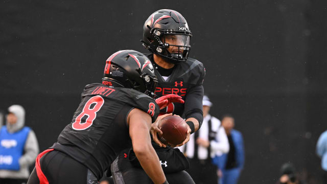 Feb 25, 2023; Las Vegas, NV, USA; Vegas Vipers quarterback Brett Hundley (2) hands the ball off to running back John Lovett (8) against the D.C. Defenders in the first quarter at Cashman Field. Mandatory Credit: Candice Ward-USA TODAY Sports  