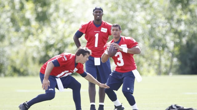 Jun 12, 2013; Renton, WA, USA; Seattle Seahawks quarterback Russell Wilson (3) and quarterback Brady Quinn (10) do a drill following minicamp practice at the Virginia Mason Athletic Center. Seattle Seahawks quarterback Jerrod Johnson (1) stands behind Wilson and Quinn.