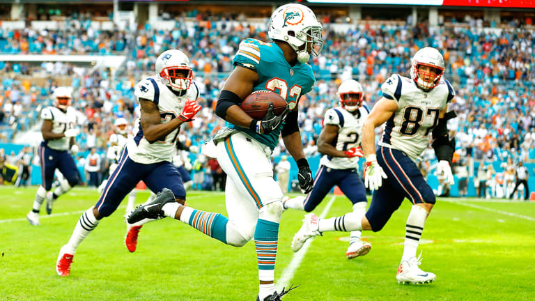 Dolphins beat Patriots on a beautiful game-winning lateral - Sports Illustrated
