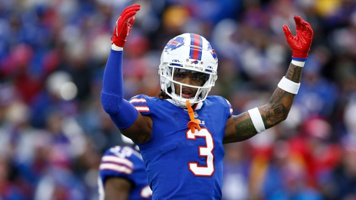 Buffalo Bills quarterback Josh Allen, center, walks the field during  practice while players wear the number 3 in support of safety Damar Hamlin  during practice before an NFL football game against the