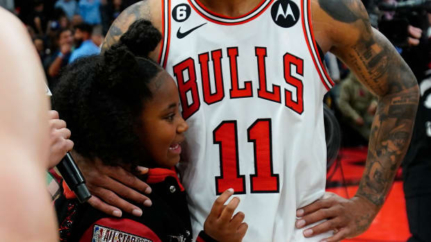 Apr 12, 2023; Toronto, Ontario, CAN; Chicago Bulls forward DeMar DeRozan (11) gets a hug from his daughter after a win over the Toronto Raptors in the NBA Play-In game