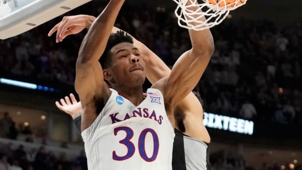 Mar 25, 2022; Chicago, IL, USA; Kansas Jayhawks guard Ochai Agbaji (30) dunks during the second half against the Providence Friars in the semifinals of the Midwest regional of the men's college basketball NCAA Tournament at United Center. Mandatory Credit: David Banks-USA TODAY Sports