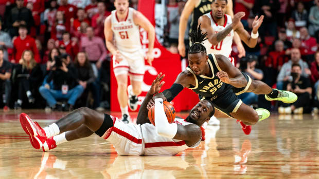 Nebraska forward Juwan Gary and Purdue guard Lance Jones fight for a loose ball during the first half Tuesday night at Pinnacle Bank Arena in Lincoln. (Jan 9, 2024) 