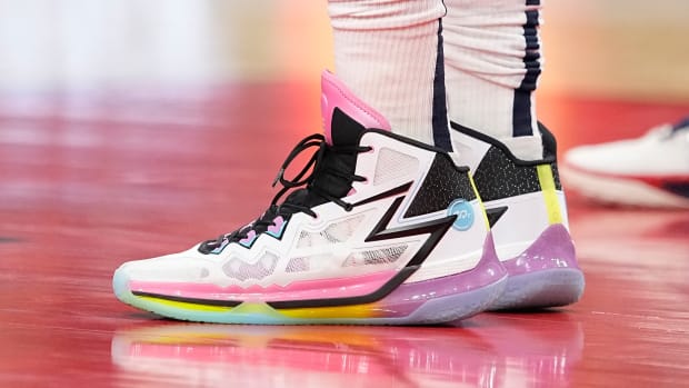 Denver Nuggets center Nikola Jokic's white and pink sneakers.