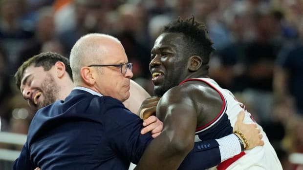 Apr 3, 2023; Houston, TX, USA; Connecticut Huskies head coach Dan Hurley celebrates with Connecticut Huskies forward Adama Sanogo