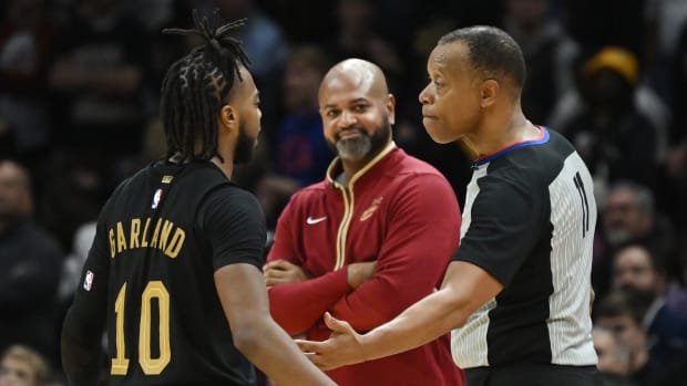 Nov 2, 2022; Cleveland, Ohio, USA; Cleveland Cavaliers guard Darius Garland (10) argues a call with referee Rodney Mott (71) as head coach J.B. Bickerstaff looks on during the second half against the Boston Celtics at Rocket Mortgage FieldHouse. Mandatory Credit: Ken Blaze-USA TODAY Sports