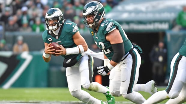 Philadelphia Eagles quarterback Jalen Hurts runs with the ball.