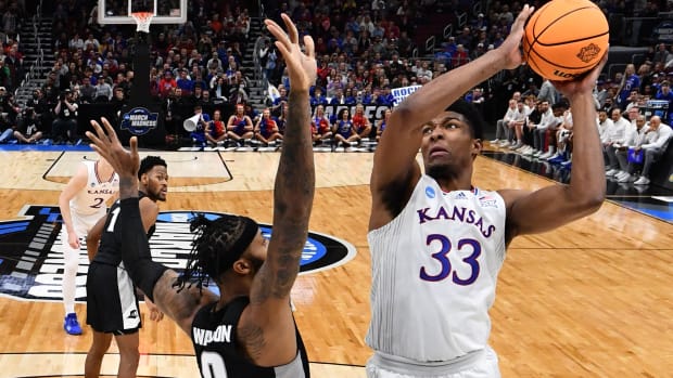 Mar 25, 2022; Chicago, IL, USA; Kansas Jayhawks forward David McCormack (33) shoots over Providence Friars center Nate Watson (0) during the first half in the semifinals of the Midwest regional of the men's college basketball NCAA Tournament at United Center. Mandatory Credit: Jamie Sabau-USA TODAY Sports