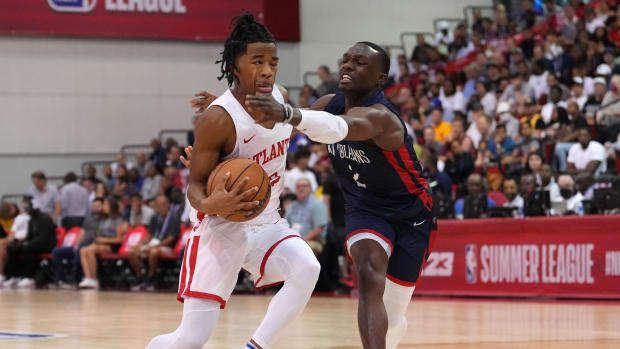 Atlanta Hawks guard Sharife Cooper (2) is hit in the face by New Orleans Pelicans guard Jared Harper (2) during an NBA Summer League game at Cox Pavilion.