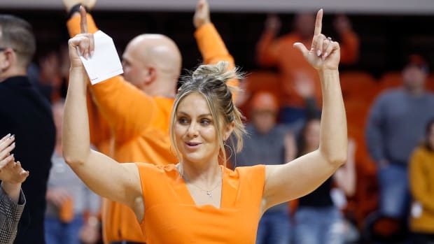 Oklahoma State head coach Jacie Hoyt sings the alma mater following the college women's basketball game between the Oklahoma State Cowgirls and the TCU Horned Frogs at Gallagher-Iba Arena in Stillwater, Okla., Saturday, Jan.14, 2023. Osu V Tcu Wbb