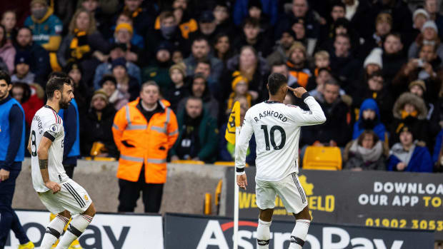 Manchester United no.10 Marcus Rashford pictured celebrating after scoring against Wolves on New Year's Eve in 2022