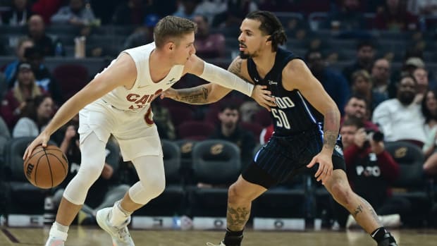 Oct 12, 2023; Cleveland, Ohio, USA; Orlando Magic guard Cole Anthony (50) defends Cleveland Cavaliers guard Sam Merrill (5) during the first half at Rocket Mortgage FieldHouse.