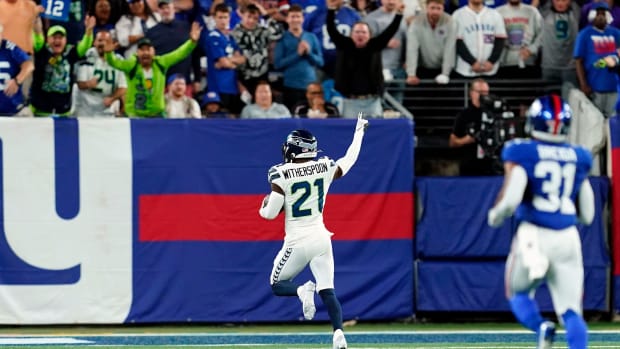 Seattle Seahawks cornerback Devon Witherspoon (21) scores a touchdown after intercepting a pass thrown by New York Giants quarterback Daniel Jones (not pictured) in the second half. The Seahawks defeat the Giants, 24-3, at MetLife Stadium on Monday, Oct. 2, 2023, in East Rutherford.