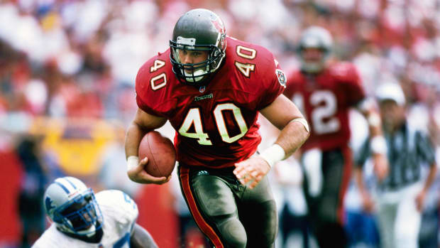 Tampa Bay Buccaneers' Mike Alstott points toward the stands after