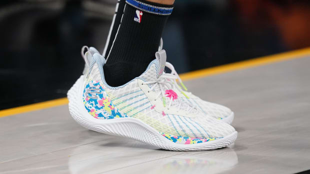 View of Stephen Curry's white and blue shoes.