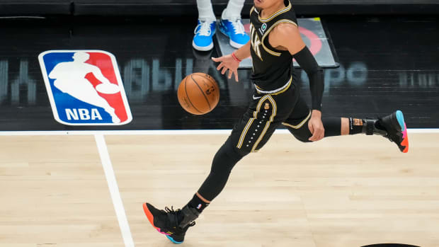 Atlanta Hawks guard Trae Young (11) dribbles the ball against the New York Knicks during the first half in game four in the first round of the 2021 NBA Playoffs at State Farm Arena.