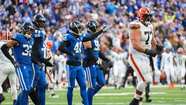 Cleveland Browns guard Wyatt Teller (77) celebrates as the Indianapolis Colts show dejection after the Browns scored a touchdown late in the second half of the game Sunday, Oct. 22, 2023, at Lucas Oil Stadium in Indianapolis. The Browns defeated the Colts, 39-38.