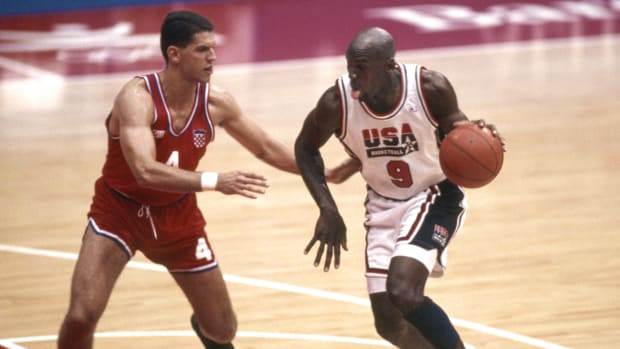 Aug 8, 1992; Badalona, SPAIN; FILE PHOTO; USA Dream Team guard Michael Jordan (9) is defended by Croatia guard Drazen Petrovic (4) during the 1992 Barcelona Olympic Games at Pavello Olympic Arena.