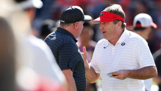 Georgia coach Kirby Smart speaks with Kentucky coach Mark Stoops before an NCAA college football game between Kentucky and Georgia in Athens, Ga., on Saturday, Oct. 16, 2021. News Joshua L Jones