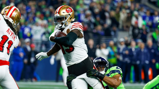 San Francisco 49ers wide receiver Deebo Samuel (19) rushes against Seattle Seahawks linebacker Bobby Wagner (54) during the first quarter at Lumen Field.