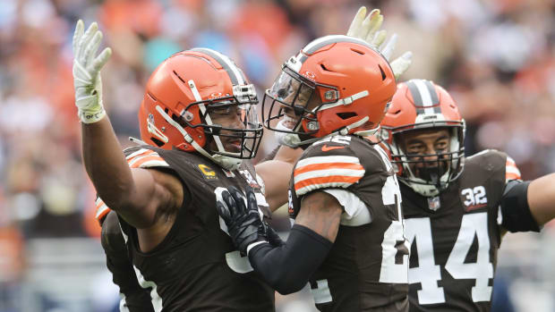 Sep 24, 2023; Cleveland, Ohio, USA; Cleveland Browns defensive end Myles Garrett (95) and safety Grant Delpit (22) and linebacker Sione Takitaki (44) celebrate after sacking Tennessee Titans quarterback Ryan Tannehill (not pictured) during the second half at Cleveland Browns Stadium.