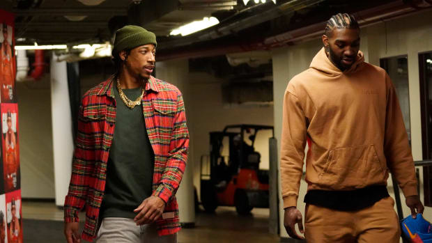 Mar 22, 2023; Chicago, Illinois, USA; Chicago Bulls forward DeMar DeRozan and forward Patrick Williams enter the building before the game against the Philadelphia 76ers at United Center.