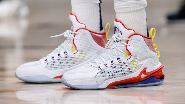 View of Nikola Jokic's white, red, and blue Nike shoes.