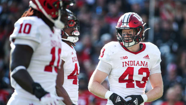 Indiana redshirt freshman linebacker Matt Hohlt (43) stands beside teammates Aaron Casey (44) and Myles Jackson (10) during Indiana's game against Cincinnati at Nippert Stadium on Sept. 24.