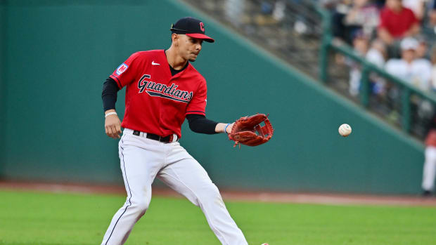 Aug 22, 2023; Cleveland, Ohio, USA; Cleveland Guardians second baseman Andres Gimenez (0) fields a ball hit by Los Angeles Dodgers left fielder David Peralta (not pictured) during the fourth inning at Progressive Field. Mandatory Credit: Ken Blaze-USA TODAY Sports