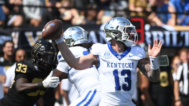 Sep 23, 2023; Nashville, Tennessee, USA; Kentucky Wildcats quarterback Devin Leary (13) throws a pass against the Vanderbilt Commodores during the first half at FirstBank Stadium. Mandatory Credit: Christopher Hanewinckel-USA TODAY Sports