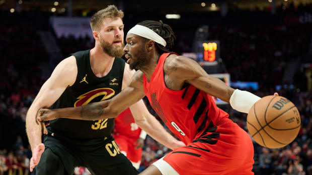 Nov 15, 2023; Portland, Oregon, USA; Portland Trail Blazers forward Jerami Grant (9) drives to the basket during the first half against Cleveland Cavaliers forward Dean Wade (32) at Moda Center.