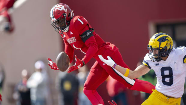 Indiana Hoosiers defensive back Devon Matthews (1) intercepts a ball meant for Michigan Wolverines wide receiver Ronnie Bell (8) in the end zone during the second half at Memorial Stadium. Wolverines won 31-10.