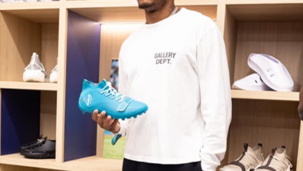 Jalen Ramsey holds his cleats in a sneakers store.