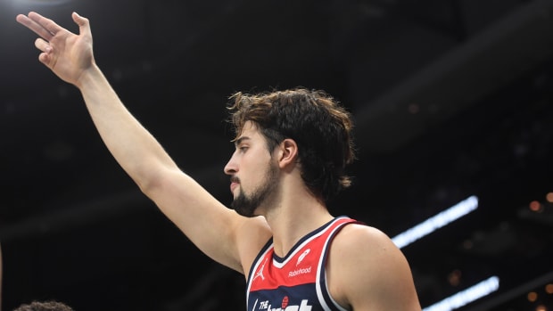 Washington Wizards forward Deni Avdija (8) reacts after his team scores during the second half against the Charlotte Hornets at the Spectrum Center.