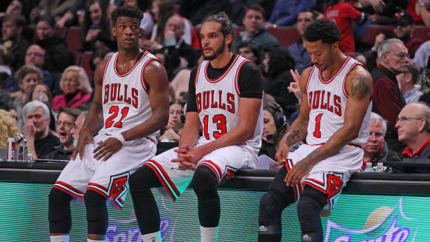 Feb 21, 2015; Chicago, IL, USA; Chicago Bulls guard Jimmy Butler (21), center Joakim Noah (13), and guard Derrick Rose (1) during the second half against the Phoenix Suns at the United Center.