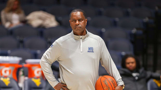Nov 15, 2022; Morgantown, West Virginia, USA; West Virginia Mountaineers associate head coach Larry Harrison watches during warmups before their game against the Morehead State Eagles at WVU Coliseum.