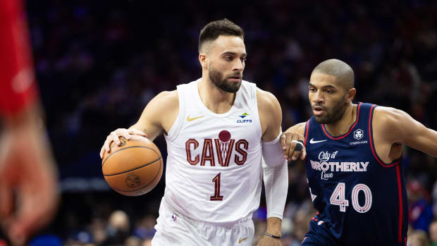 Nov 21, 2023; Philadelphia, Pennsylvania, USA; Cleveland Cavaliers guard Max Strus (1) drives against Philadelphia 76ers forward Nicolas Batum (40) during the first quarter at Wells Fargo Center.