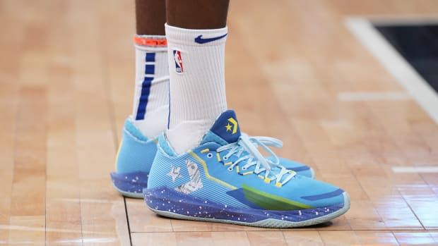View of Draymond Green's blue Converse shoes.
