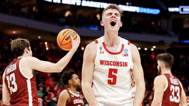 Wisconsin forward Tyler Wahl reacts to a big basket against Colgate.