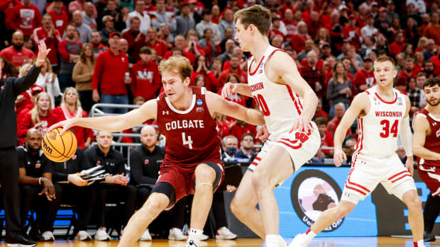 Wisconsin forward Ben Carlson defending his man against Colgate.