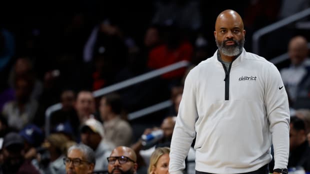 Washington Wizards head coach Wes Unseld Jr. looks on from the bench against the Philadelphia 76ers in the second quarter at Capital One Arena.