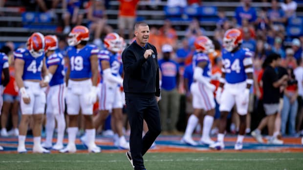 Florida Gators head coach Billy Napier cheers before the game.