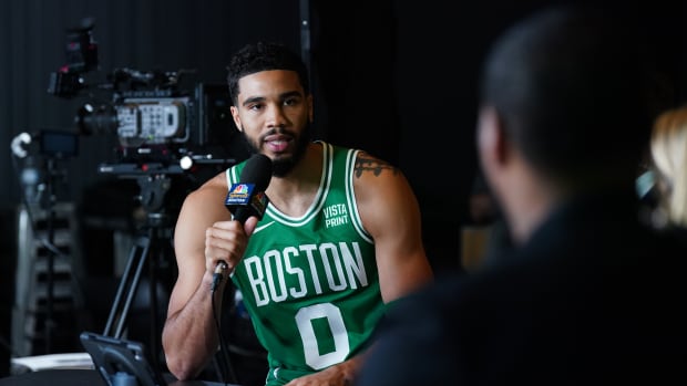 Jayson Tatum catches up with Duke University's Mike Krzyzewski