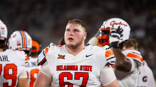 Sep 9, 2023; Tempe, Arizona, USA; Oklahoma State Cowboys offensive lineman Cole Birmingham (67) against the Arizona State Sun Devils at Mountain America Stadium. Mandatory Credit: Mark J. Rebilas-USA TODAY Sports