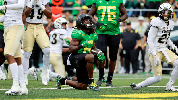 Oregon Ducks running back Noah Whittington celebrates after scoring a touchdown against the Colorado Buffaloes.